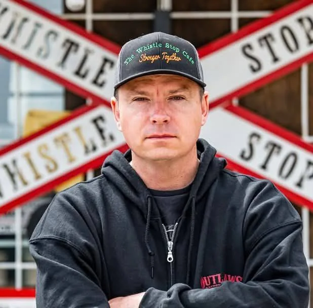 Christopher Scott outside The Whistle Stop Café in Mirror